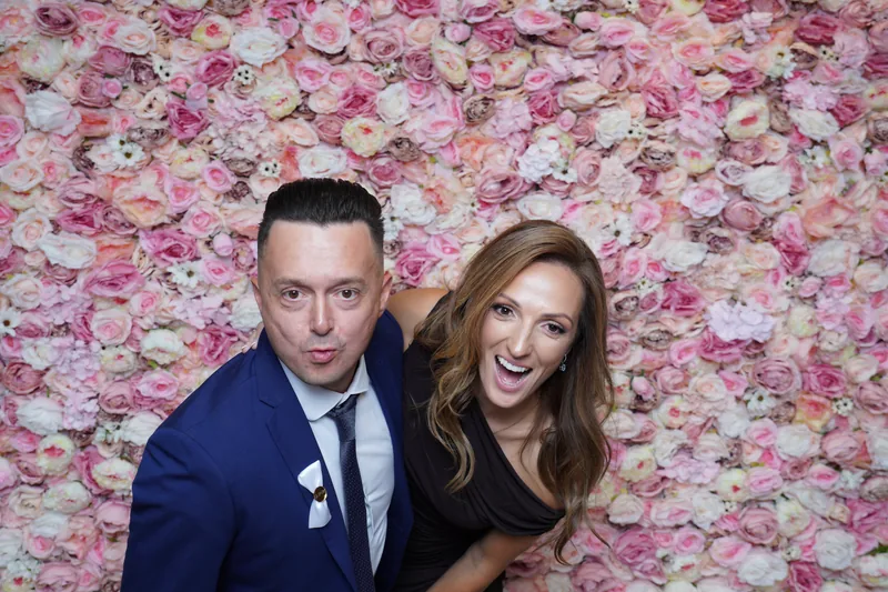 Couple enjoying the wedding photo booth