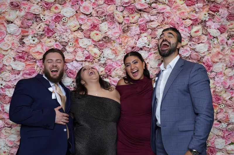 Wedding guests enjoying the photo booth