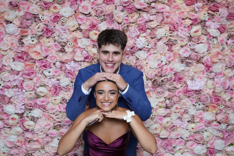 Bride and groom having fun at the photo booth